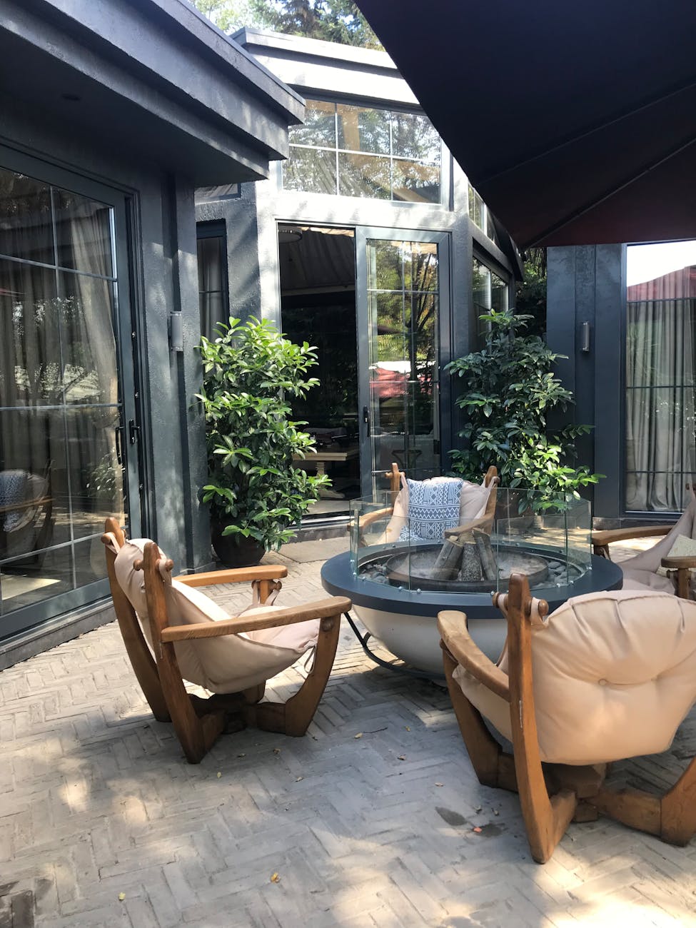 cozy outdoor patio with wooden lounge chairs